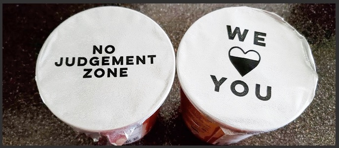 The tops of ice cream containers containing inspirational phrases.